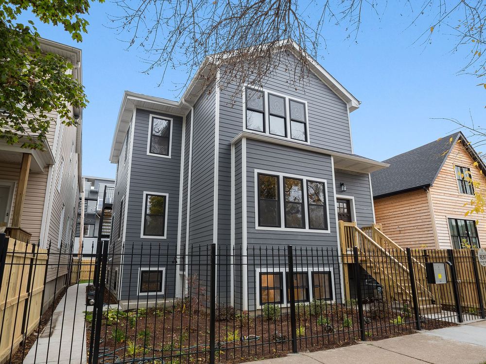 1754 North Troy Street after, 2024: a three-unit building